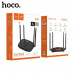 Wi-Fi роутер HOCO DQ03 Vast. Интерфейс: LAN: 4х1000 Мбит/с, WAN: 1х1000 Мбит/с. Мощность зарядки: 12 В постоянного тока/1 А. Антенна: 2х2,4 ГГц (5 дБи) + 2х5 ГГц (5 дБи). Скорость беспроводной связи: 2,4 ГГц: 573,5 Мбит/с, 5 ГГц: 1201 Мбит/с. Память: Flas